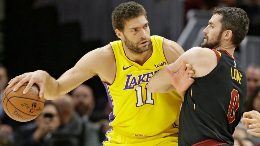 Brook Lopez drives against Kevin Love of Cleveland in a game last month.