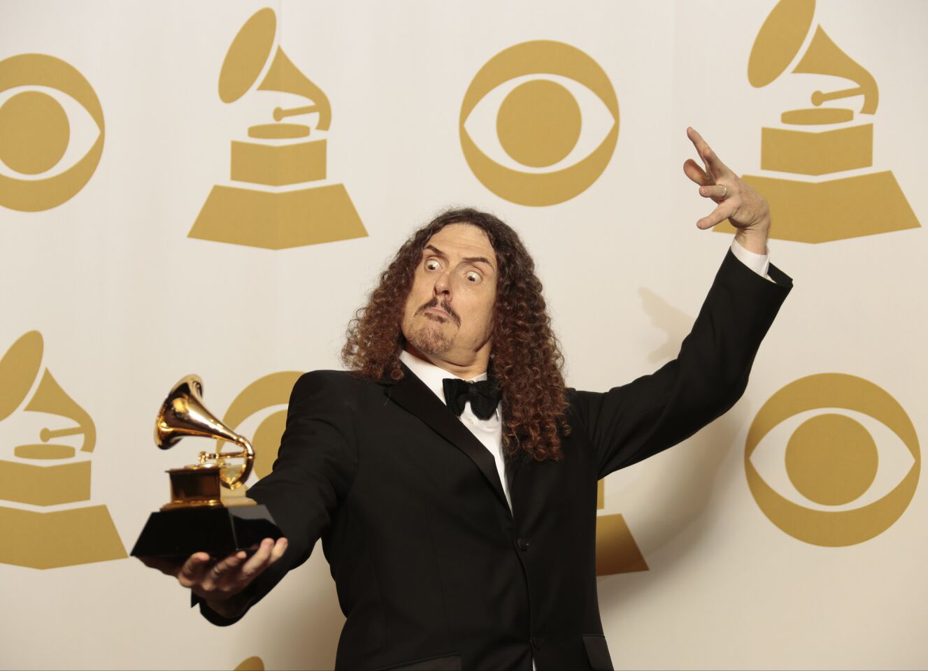 "Weird Al" Yankovic holds his Grammy for comedy album for "Mandatory Fun."