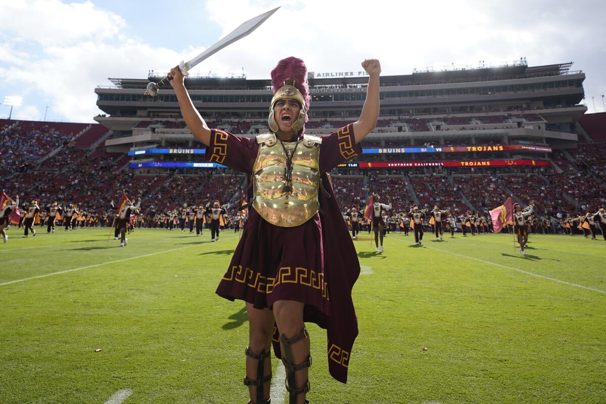 Southern California drum major Jacobo Herrera performs before an NCAA college football game against UCLA