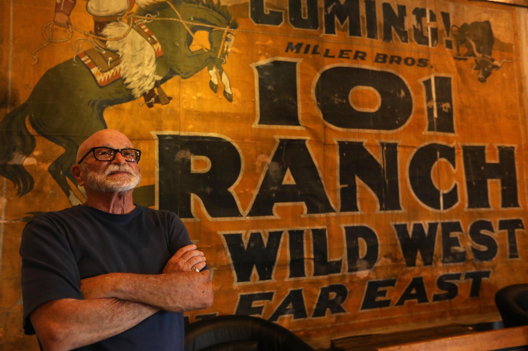 Chris Langley stands in front of an old film ranch sign inside the Museum of Western Film History in Lone Pine
