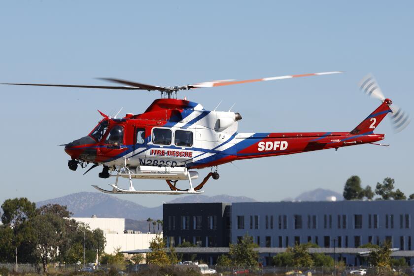 San Diego CA - : San Diego Fire Rescue's Helicopter 2, a Bell 412EP takes off from Montgomery-Gibbs Executive Airport in San Diego, CA.San Diego is spending $21 million on a new firefighting helicopter, similar to this one. (K.C. Alfred / The San Diego Union-Tribune)