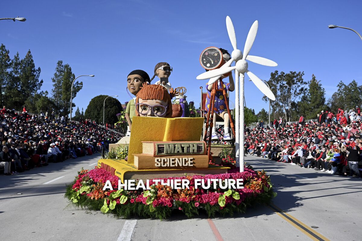 The Kaiser Permanente float makes its way along the parade route at the 133rd Rose Parade in Pasadena, Calif., Saturday, Jan. 1, 2022. A year after New Year's Day passed without a Rose Parade due to the coronavirus pandemic, the floral spectacle celebrating the arrival of 2022 proceeded Saturday despite a new surge of infections due to the omicron variant. (AP Photo/Michael Owen Baker)