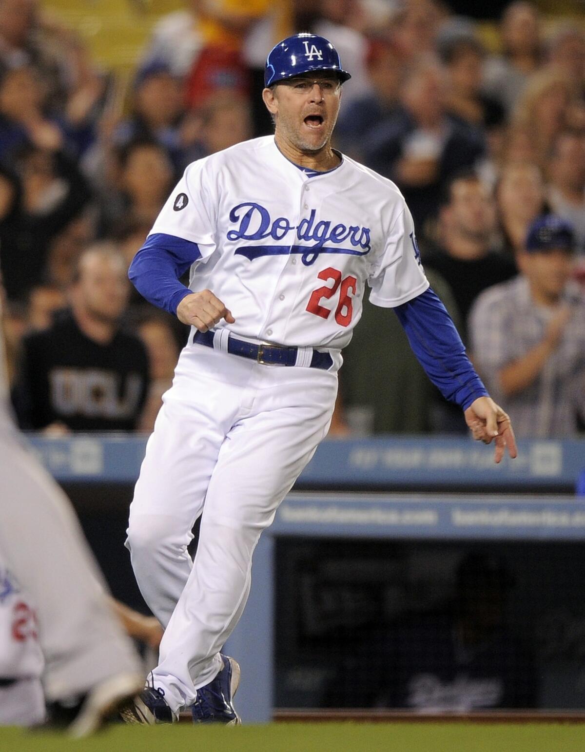 Tim Wallach has served as the Dodgers' third-base coach since 2011.