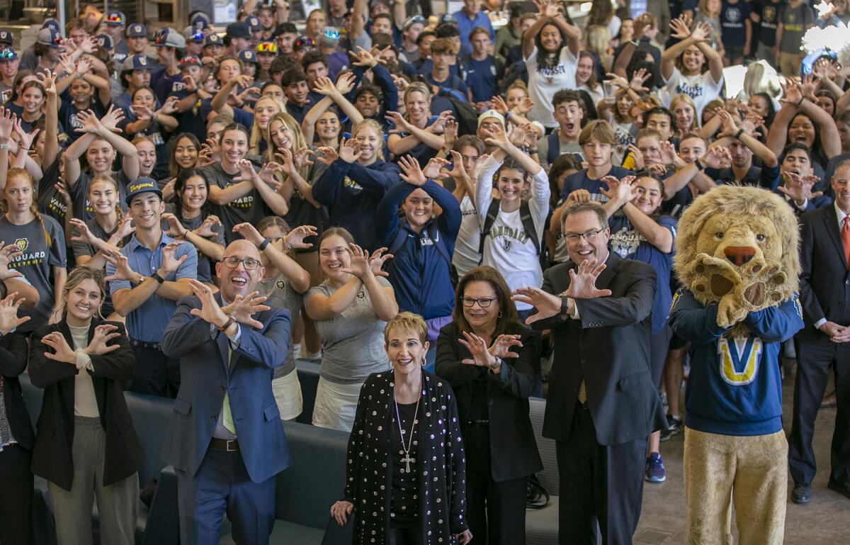 Evelyn Freed, center bottom, poses for a photo with over 400 student-athletes and campus administrators on Tuesday.