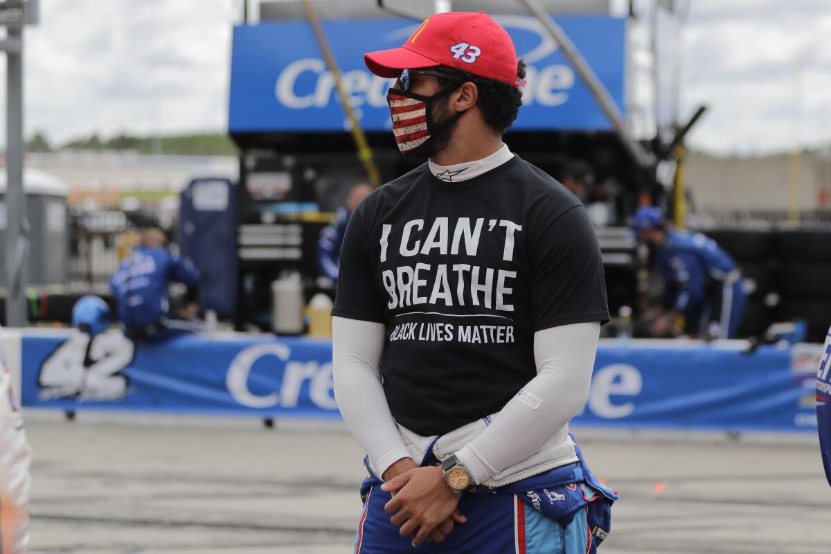 NASCAR driver Bubba Wallace wears a "I Can't Breath, Black Lives Matter" shirt.