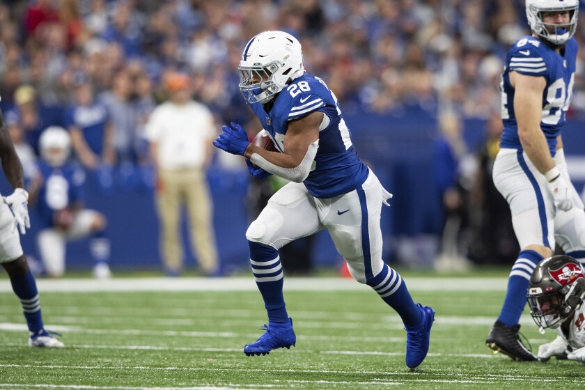 Indianapolis Colts running back Jonathan Taylor runs up the middle against the Tampa Bay Buccaneers.