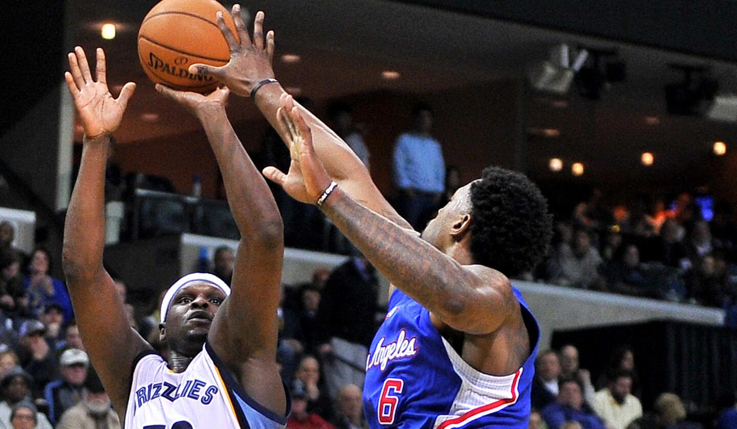 Clippers center DeAndre Jordan tries to block a shot by Grizzlies forward Zach Randolph in the second half Friday night in Memphis.