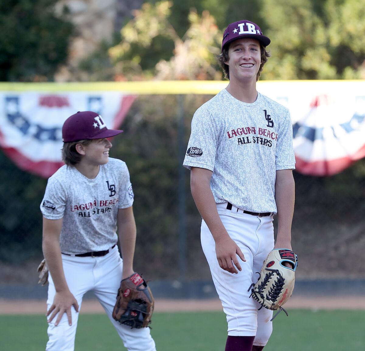 Will Kimball and Wyatt Bogdan, from left, take their positions at third base during practice on Tuesday.