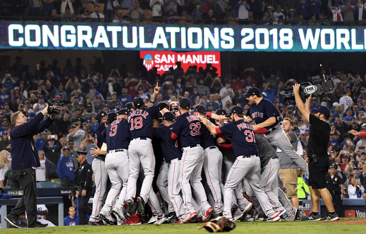 The Red Sox celebrate after defeating the Dodgers in Game 5 of the 2018 World Series.