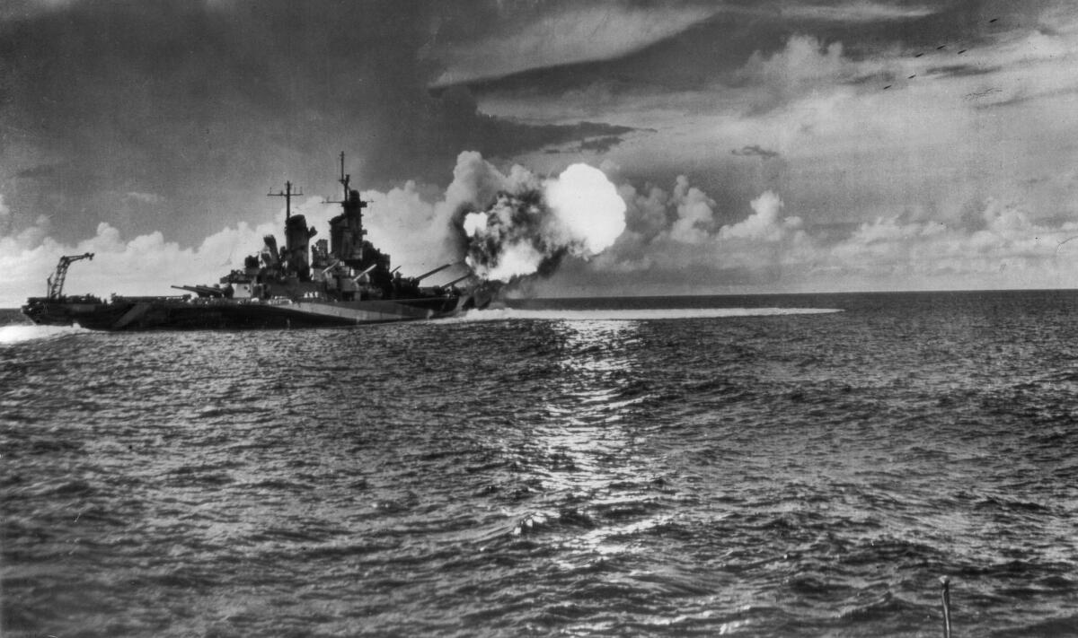 1944: The battleship Missouri fires a salvo from the two forward turrets. The 16-inch projectiles can be seen at upper right. This photo appeared in the Nov. 14, 1944, Los Angeles Times.