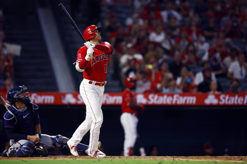 Angels star Shohei Ohtani hits a home run in the eighth inning against the Twins on Saturday.