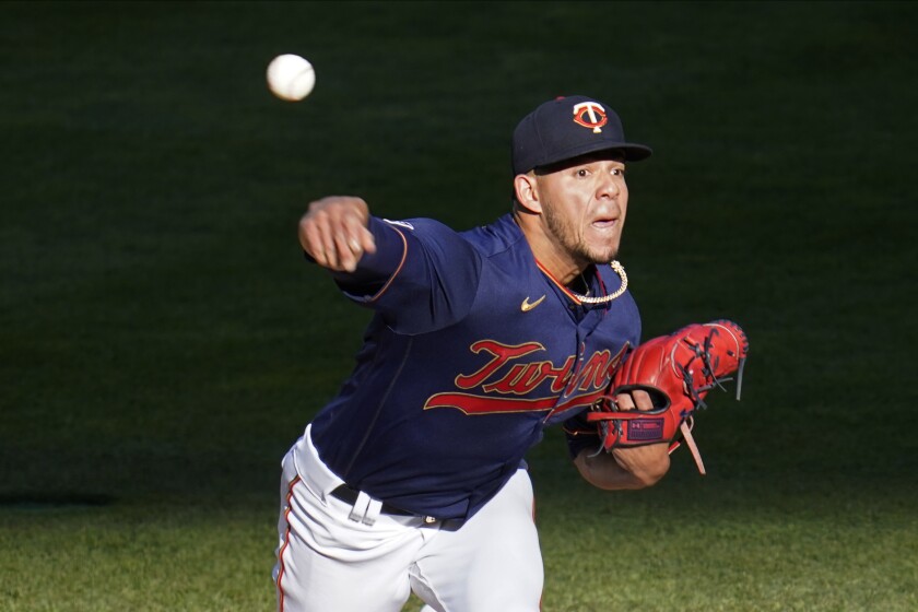 Minnesota Twins pitcher Jose Berrios throws against the Houston Astros in the first inning of a baseball game, Saturday, June 12, 2021, in Minneapolis. (AP Photo/Jim Mone)