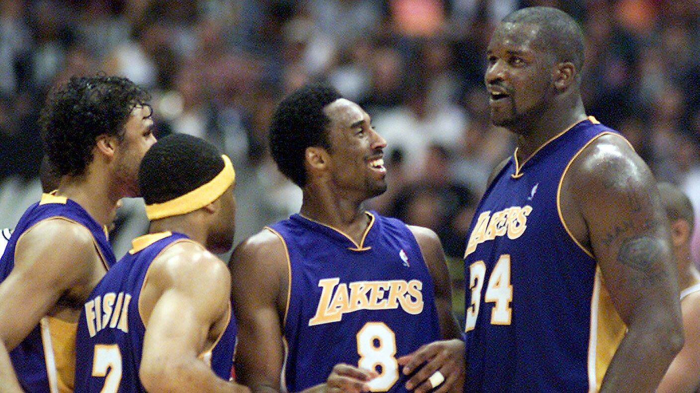 Lakers star Kobe Bryant, center, is all smiles while standing next to teammates (from left) Derek Fisher, Rick Fox and Shaquille O'Neal during Game 1 of the 2001 Western Conference finals. Bryant scored 45 points in the Lakers' 104-90 win.