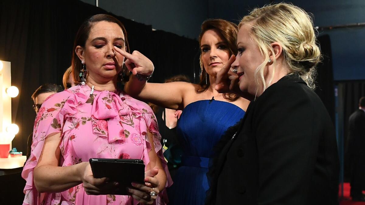 Maya Rudolph, from left, Tina Fey and Amy Poehler backstage during the Academy Awards.