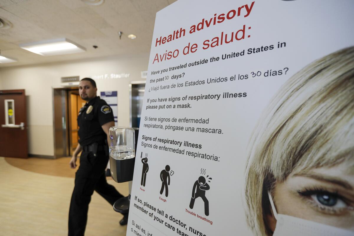 A coronavirus health advisory is posted in emergency department medical director at St. Joseph Medical Center in Orange.