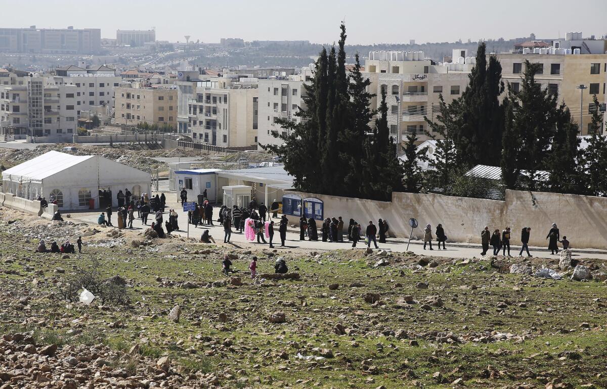 Refugees line up at the U.N. refugee agency in Amman, Jordan, in February.