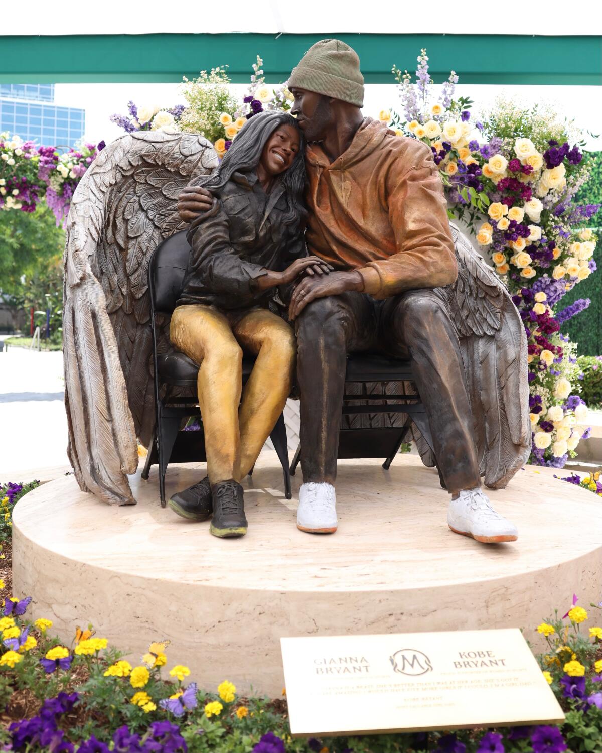 A new statue honoring Kobe and Gianna Bryant is on display outside Crypto.com Arena.