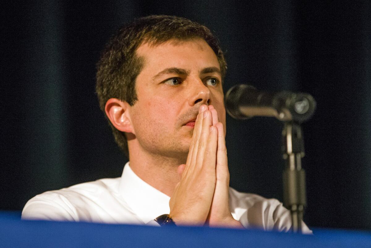 Democratic presidential candidate and South Bend Mayor Pete Buttigieg looks on during a town hall Sunday in South Bend, Ind.