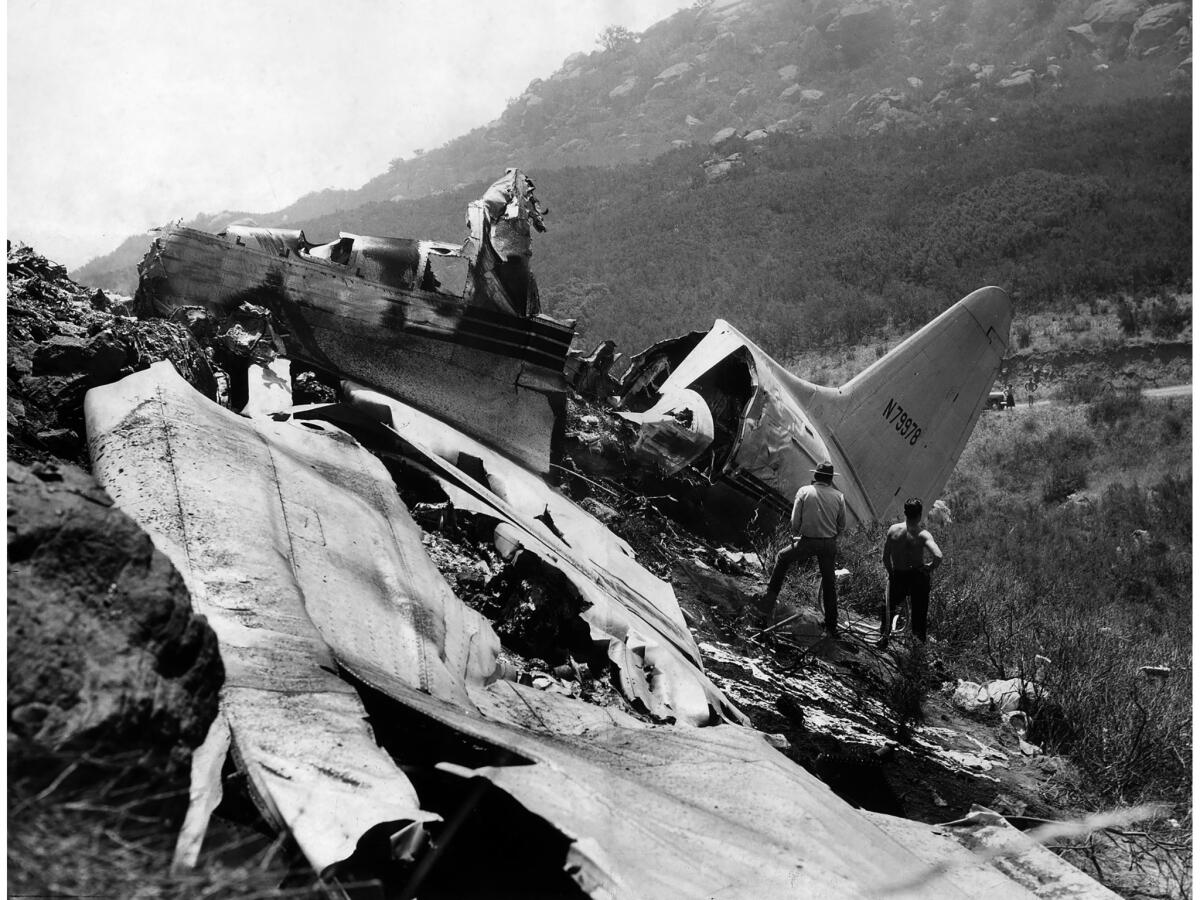 July 12, 1949: The battered fuselage and wing section of a C-46 Standard Airlines passenger plane lies on a mountainside near the Chatsworth Reservoir.