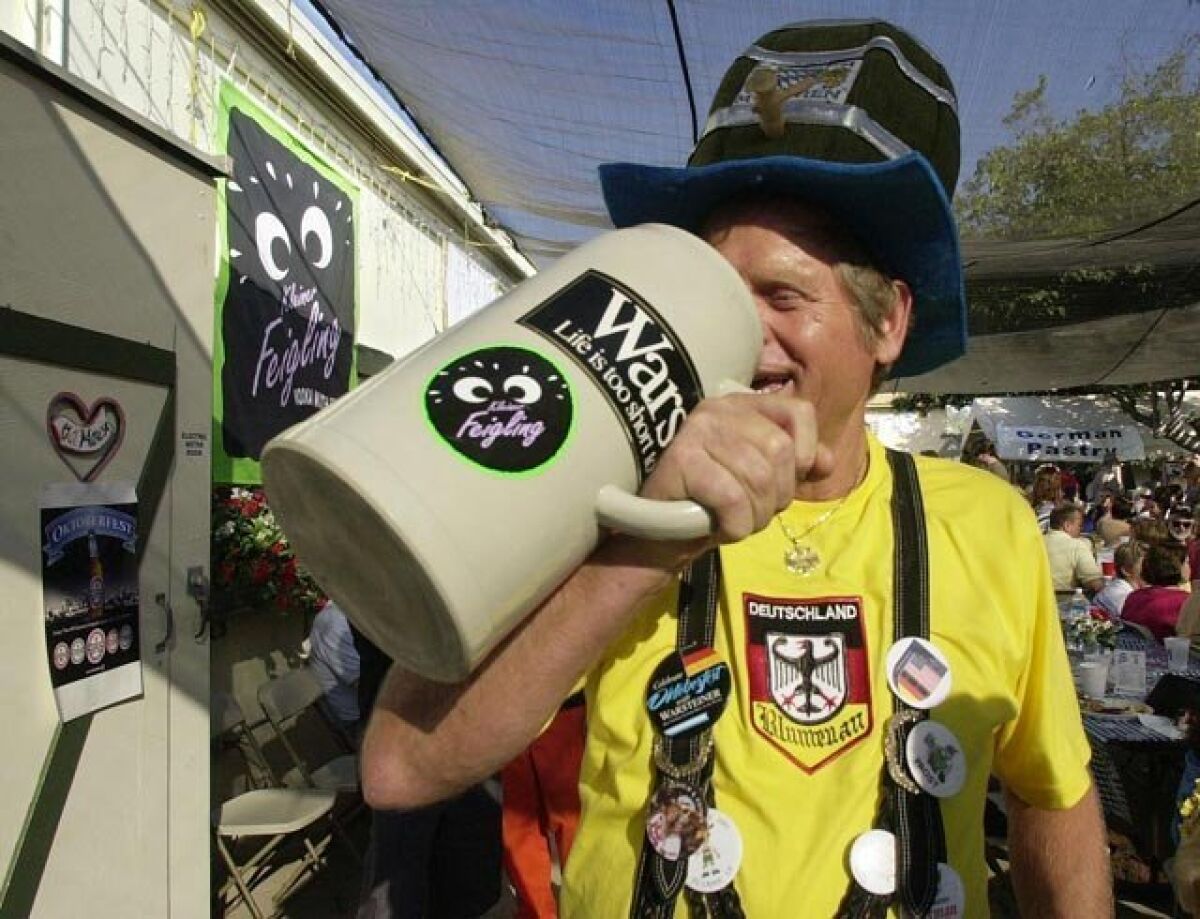 Hans Nenn, of La Jolla, drinks beer from his 5 liter mug at Oktoberfest in El Cajon.