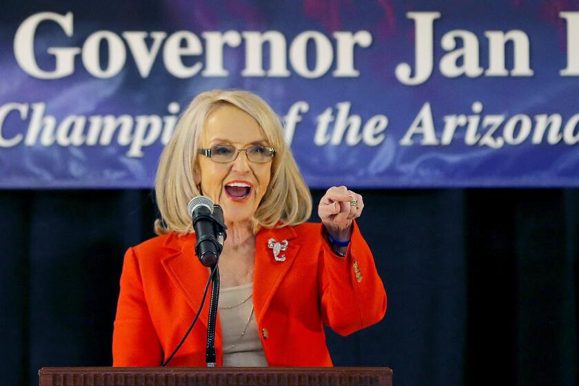 Arizona Gov. Jan Brewer announces she will not seek a third term and will retire at the end of her current term.