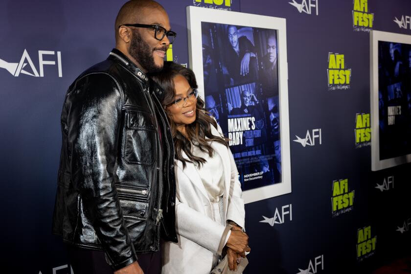 Hollywood, CA - October 27: Entertainment moguls Tyler Perry and Oprah Winfrey, on the red carpet for the premiere screening of "Maxine's Baby: The Tyler Perry Story," a documentary about Perry, as part of AFI Fest, at TCL Chinese Theatre in Hollywood, CA, Friday, Oct. 27, 2023. (Jay L. Clendenin / Los Angeles Times)