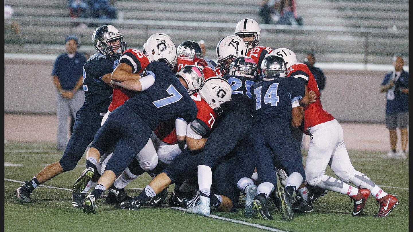 Photo Gallery: Crescenta Valley vs. Glendale in Pacific League football and the Crescenta Valley marching band takes the field in Halloween costumes