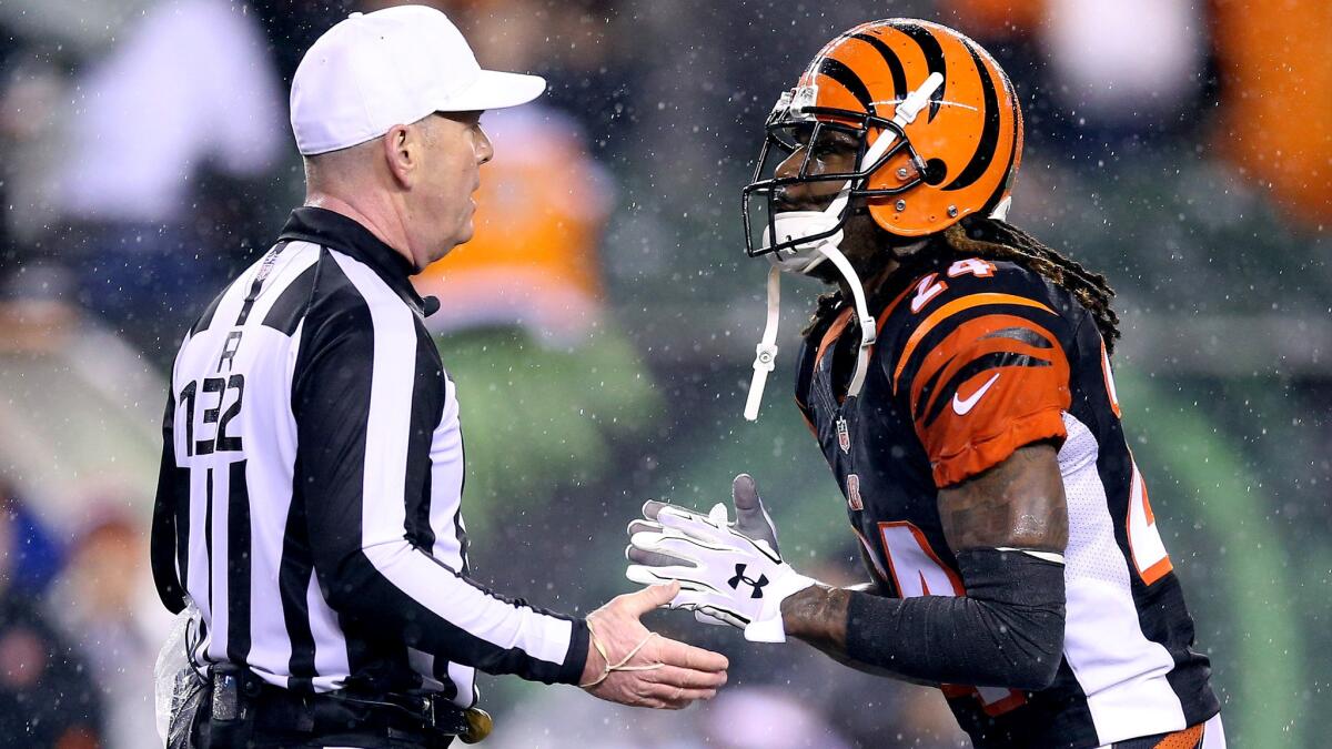 Bengals cornerback Adam "Pacman" Jones argues a call with referee John Parry during the fourth quarter of a playoff game against the Steelers.