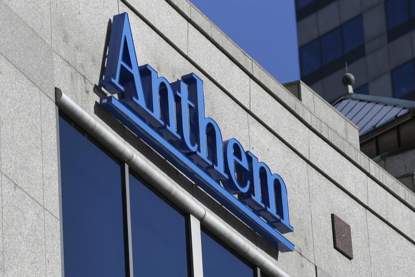 FILE - In this Thursday, Feb. 5, 2015, file photo, the Anthem logo hangs at the health insurer's corporate headquarters in Indianapolis. Anthem beat Wall Street expectations, Wednesday, Oct. 31, 2018, and hiked its 2018 forecast again as the Blue Cross-Blue Shield insurer added more Medicare customers and continued to clamp down its biggest expense, benefit payouts, in the third quarter. (AP Photo/Michael Conroy, File)