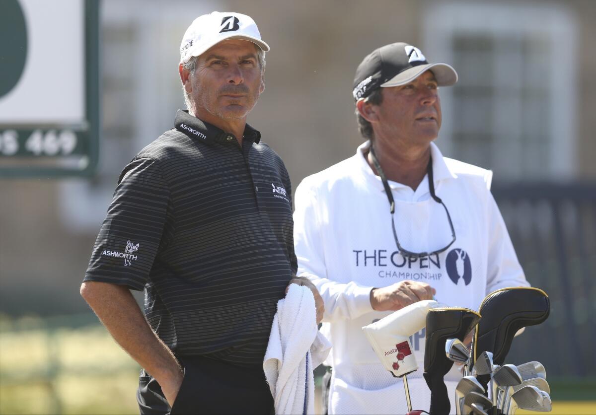Fred Couples, left, stands next to caddie Casey Kerr as he prepares to play off the 10th tee during the third round of the British Open on Saturday.