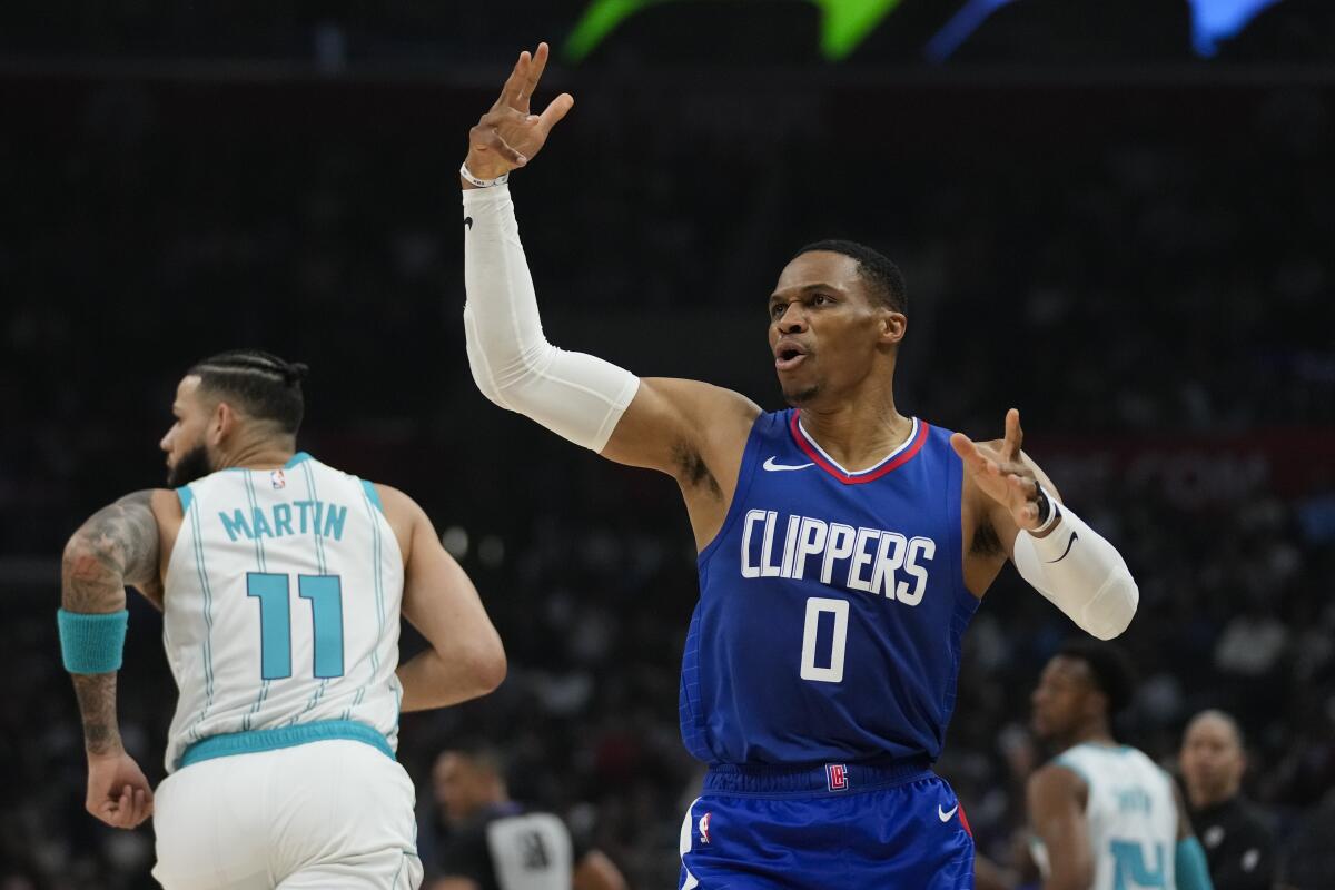 Clippers guard Russell Westbrook reacts after making a three-pointer against the Charlotte Hornets Tuesday.