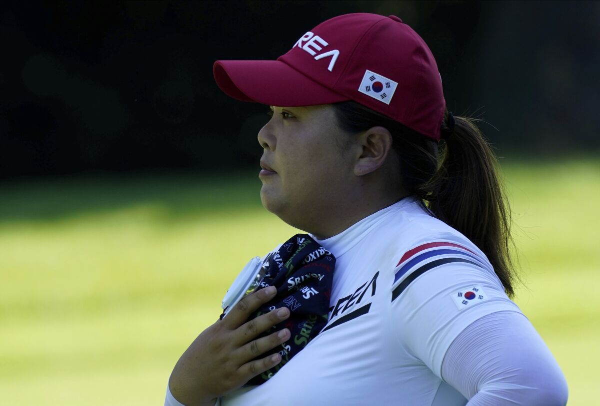 Inbee Park, of South Korea, refreshes with an ice pack on the 14th hole during the second round of the women's golf event at the 2020 Summer Olympics, Thursday, Aug. 5, 2021, at the Kasumigaseki Country Club in Kawagoe, Japan. (AP Photo/Matt York)