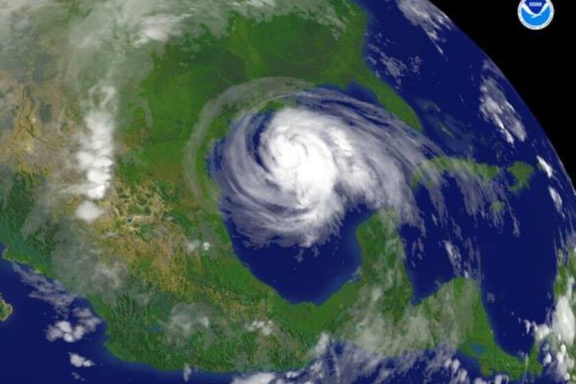 A satellite photo from the National Oceanic and Atmospheric Administration shows the cloud swirl of Hurricane Ike nearly filling the Gulf of Mexico as it approaches Houston.