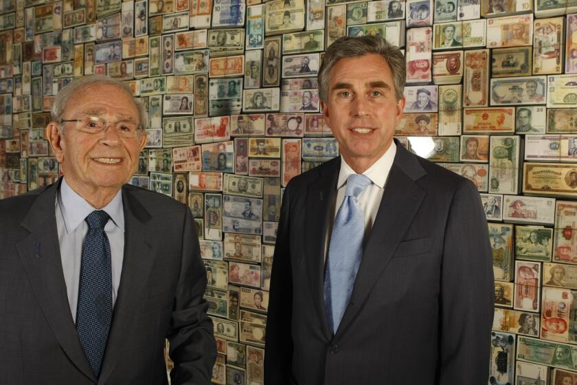 Bram Goldsmith, left, the former longtime chairman of City National Bank, and his son Russell Goldsmith, the chief executive, are photographed at City National Bank headquarters in downtown Los Angeles on May 11, 2012.