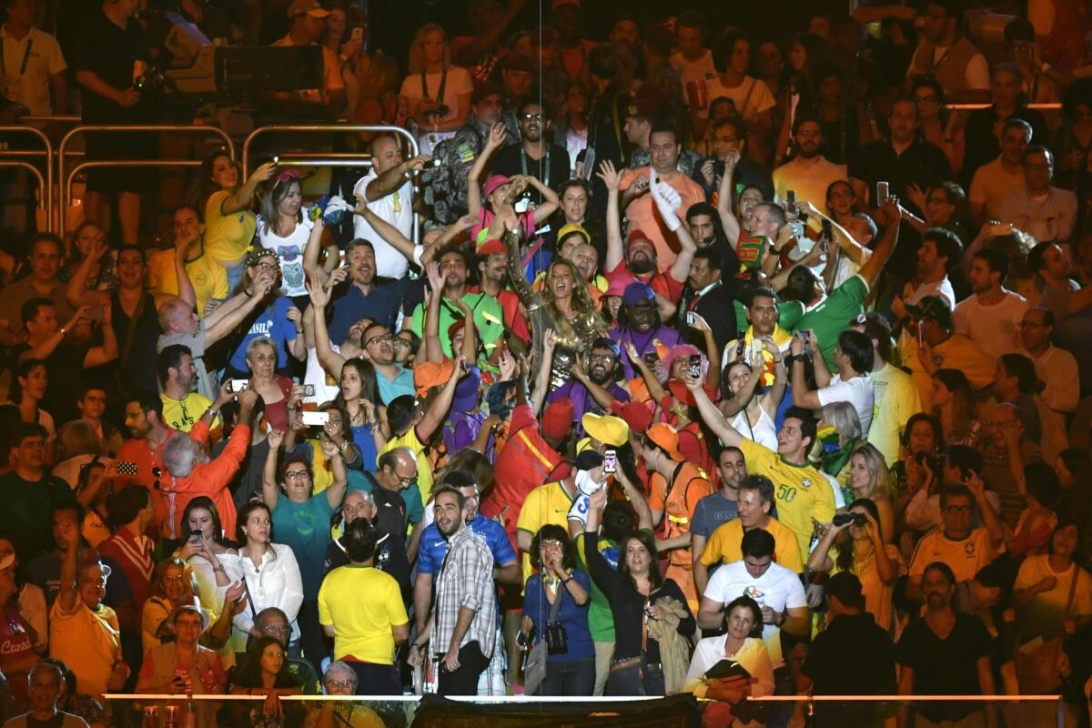 Brazilian model Gisele Bundchen dancing in the crowd during the opening ceremony of the Rio 2016 Olympic Games at the Maracana Stadium.
