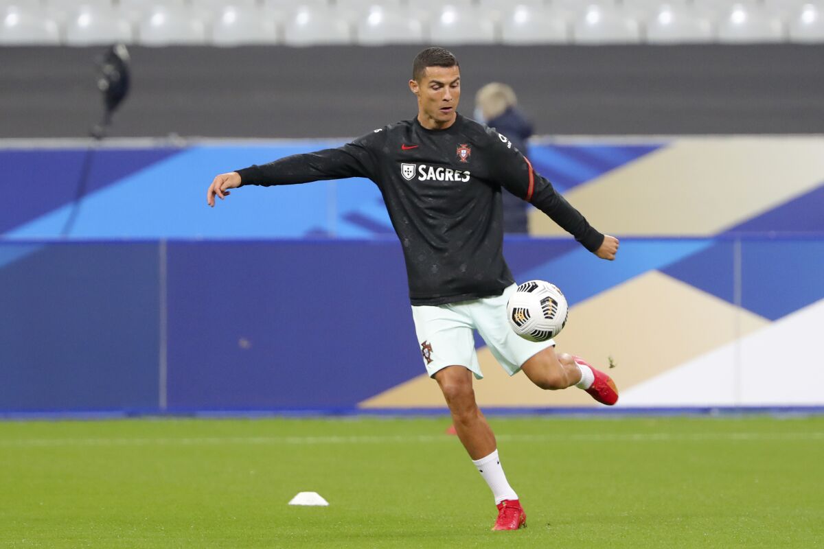 Portugal's Cristiano Ronaldo kicks a ball during warmup before a UEFA Nations League match against France
