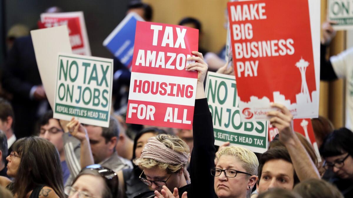 Supporters and opponents of the tax pack Tuesday's Seattle City Council meeting.