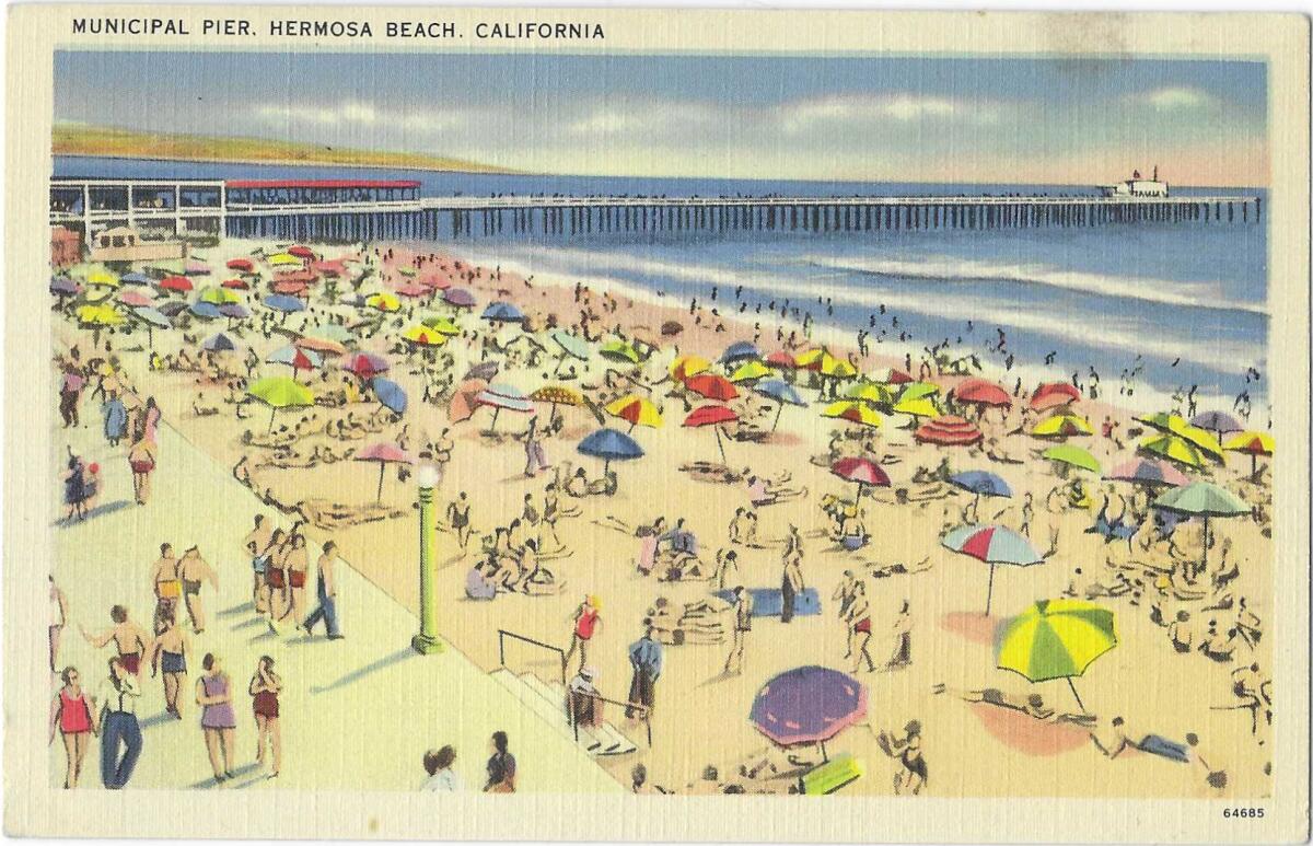 Sunbathers on the sand, people on the Strand, and the Hermosa Beach pier