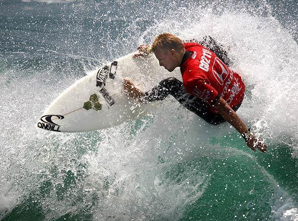 San Clemente resident Patrick Gudauskas makes a cutback en route to a score of 13.83 points, enough to win his heat Thursday during the U.S. Open of Surfing at Huntington Beach.