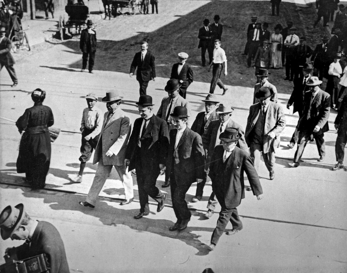 Los Angeles County sheriff's deputies escort the McNamara brothers to court in an undated photo.