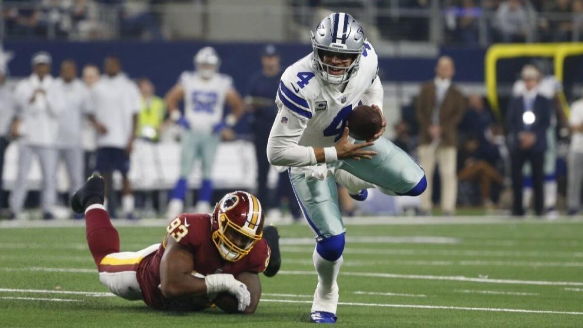 Cowboys beat Redskins to move into first place - Los Angeles Times
