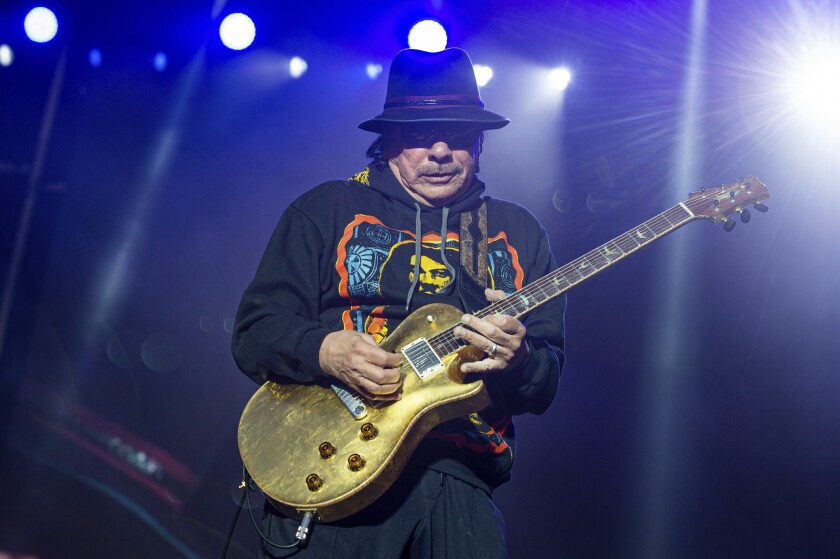 FILE - Carlos Santana performs at the BottleRock Napa Valley Music Festival on May 26, 2019, in Napa, Calif. The musician has successfully undergone a heart procedure and is canceling several Las Vegas shows planned for December. (Photo by Amy Harris/Invision/AP, File)