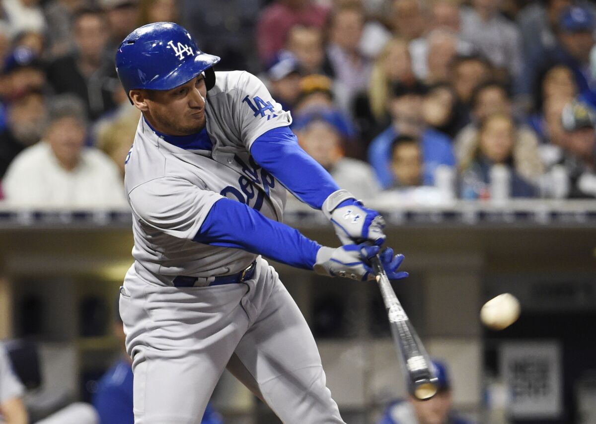Dodgers pinch-hitter Alex Guerrero delivers a run-scoring single against the Padres for the go-ahead run in the eighth inning on June 12, 2015.