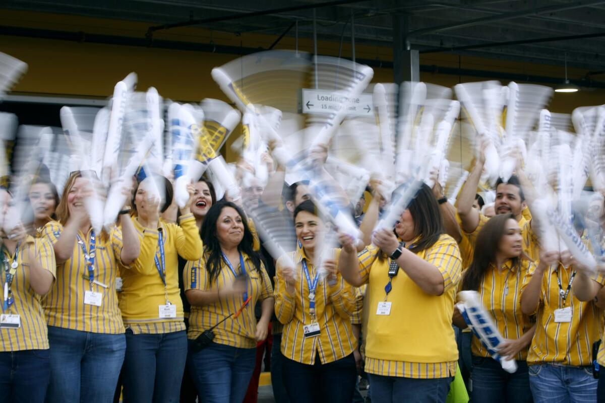 IKEA employees greeted shoppers with inflated thunder sticks.