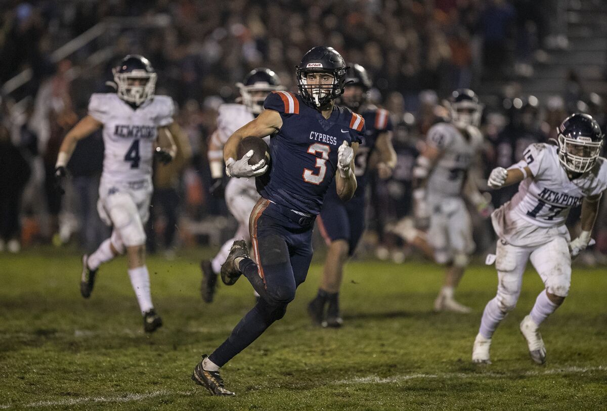 Cypress' Matthew Morrell runs up field for a second-half touchdown against Newport Harbor on Friday.