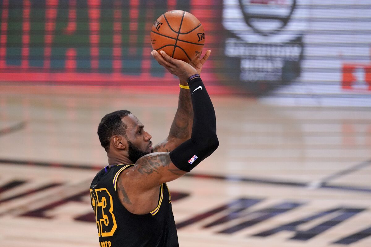 Lakers forward LeBron James pulls up for a jumper against the Heat during Game 5 on Friday night.