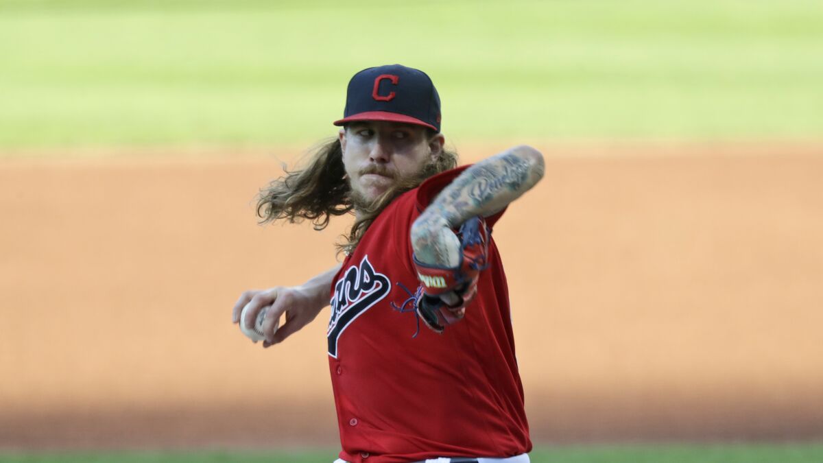 Cleveland Indians starting pitcher Mike Clevinger delivers in the first inning in a baseball game against the Cincinnati Reds, Wednesday, Aug. 5, 2020, in Cleveland. (AP Photo/Tony Dejak)