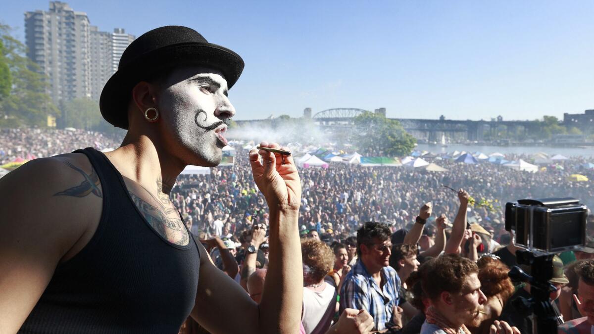 Marijuana is smoked openly at a 4/20 celebration in Vancouver, Canada.