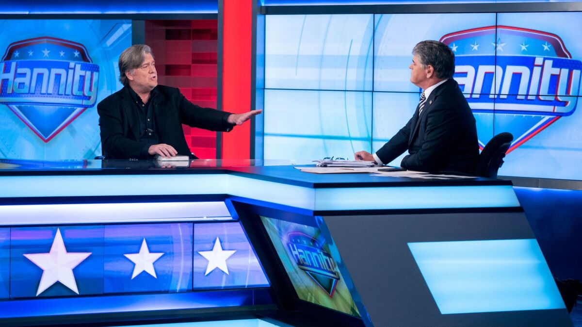 Sean Hannity interviews Former White House strategist Steve Bannon on the set of Fox News Channel's Hannity in New York on Oct. 9.