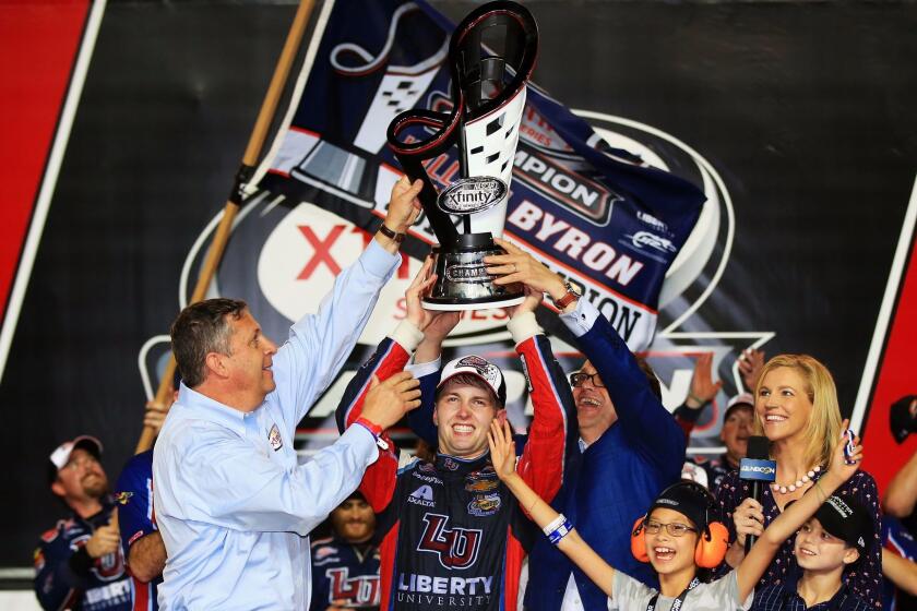 HOMESTEAD, FL - NOVEMBER 18: William Byron, driver of the #9 Liberty University Chevrolet, celebrates with the trophy in Victory Lane after placing third and winning the NASCAR XFINITY Series Championship during the NASCAR XFINITY Series Championship Ford EcoBoost 300 at Homestead-Miami Speedway on November 18, 2017 in Homestead, Florida. (Photo by Chris Trotman/Getty Images) ** OUTS - ELSENT, FPG, CM - OUTS * NM, PH, VA if sourced by CT, LA or MoD **